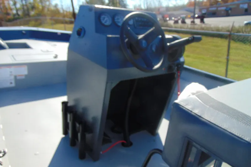 Slide: The Image of 2026 Crestliner 2070 Retriever CC boat console with steering wheel and gauges. - 11