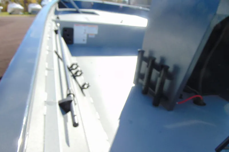 Slide: The Image of Interior view of 2026 Crestliner 2070 Retriever CC boat, showcasing rod holders and deck layout. - 12