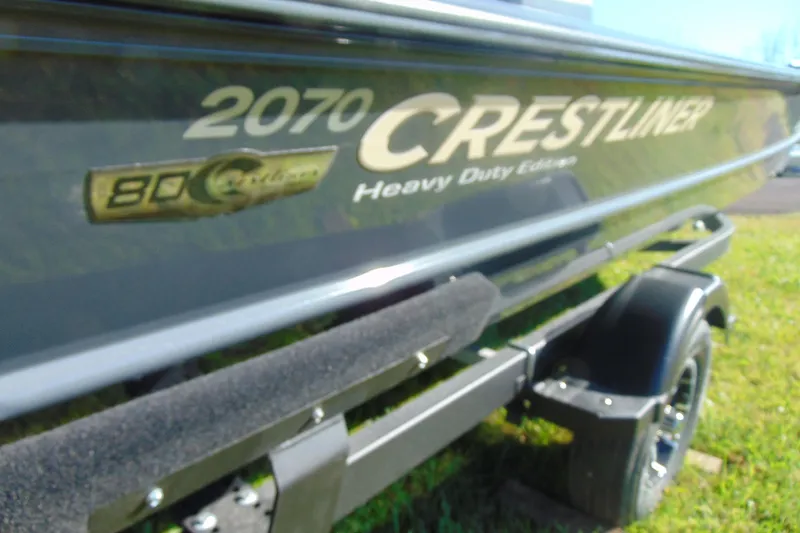 Slide: The Image of 2026 Crestliner 2070 Retriever CC boat on trailer, heavy-duty edition. - 3