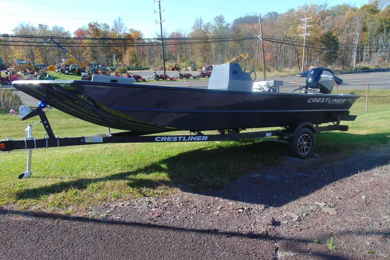 Slide: The Image of 2026 Crestliner 2070 Retriever CC boat on trailer, parked outdoors. - 6