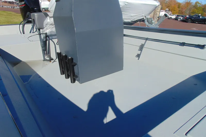 Slide: The Image of 2026 Crestliner 2070 Retriever CC boat interior with console and rod holders. - 9