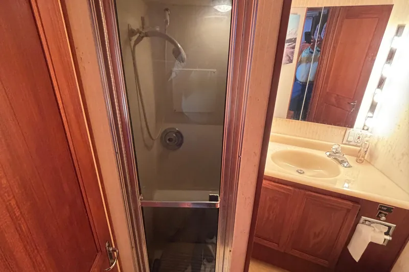 Slide: The Image of Bathroom interior of 1988 Viking Boats 41 Convertible, featuring shower and sink. - 30