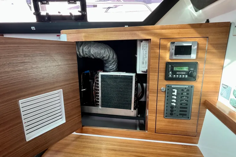 Slide: The Image of 2018 Axopar 37 Sport Cabin R interior showing control panel and ventilation system. - 33