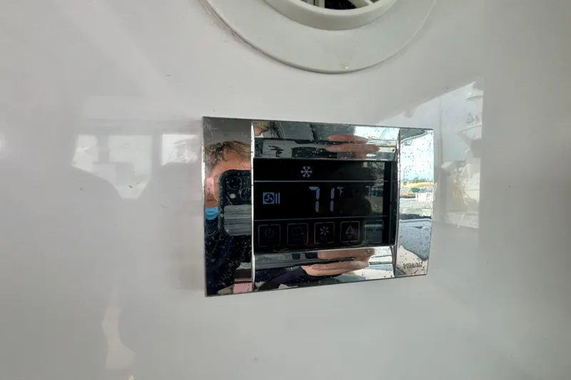 Slide: The Image of Digital temperature control panel in 2018 Axopar 37 Sport Cabin R, displaying 71°F. - 35