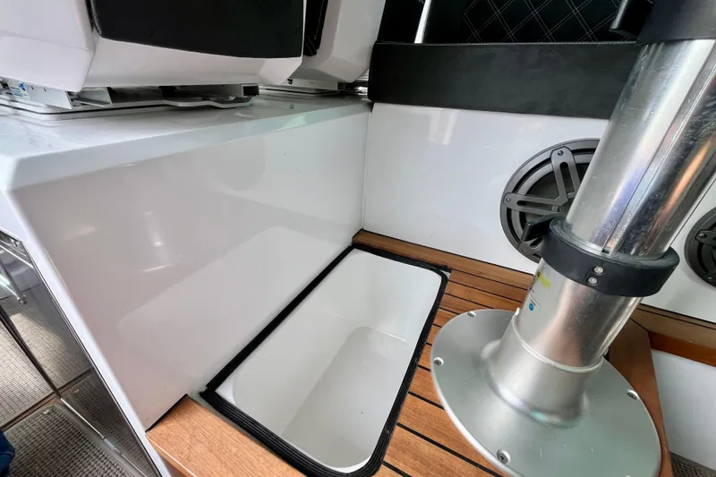 Slide: The Image of Interior view of 2018 Axopar 37 Sport Cabin R, featuring seating and speaker. - 38