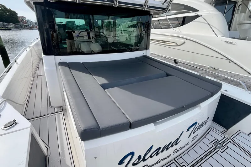 Slide: The Image of 2018 Axopar 37 Sport Cabin R with spacious sunbed and sleek design. - 6