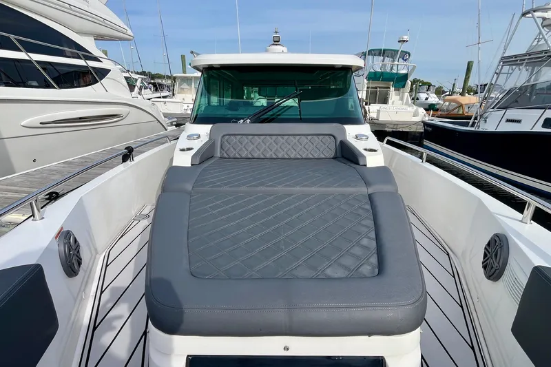 Slide: The Image of 2018 Axopar 37 Sport Cabin R with spacious deck and luxurious seating. - 8