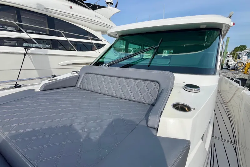 Slide: The Image of 2018 Axopar 37 Sport Cabin R with sleek seating and modern design. - 9