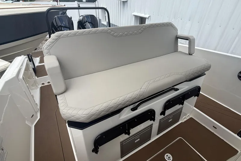 Slide: The Image of 2026 Navan S30 boat with cushioned seating and storage compartments. - 10