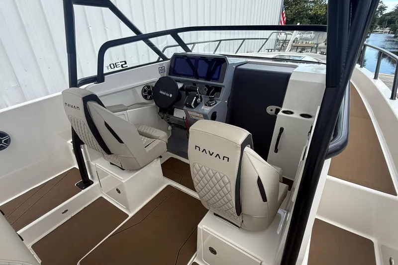 Slide: The Image of 2026 Navan S30 boat interior with modern dashboard and comfortable seating. - 11
