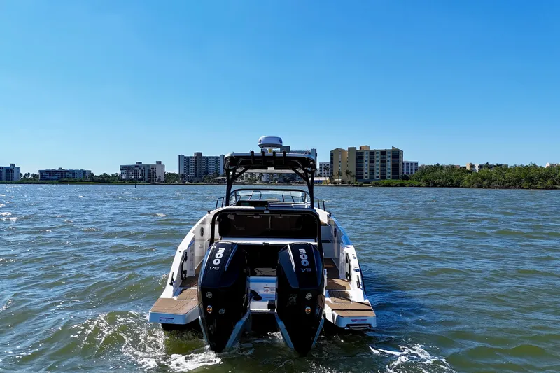 Slide: The Image of Navan S30 boat 2026 on open water with city skyline. - 4