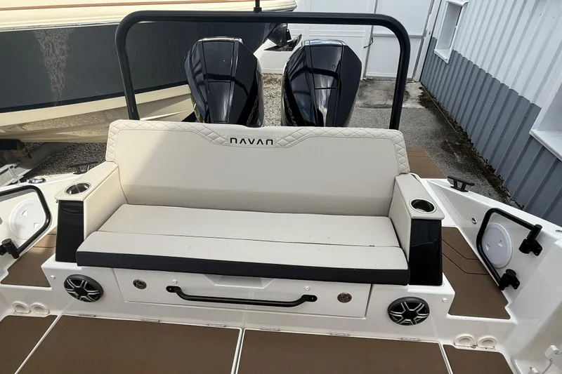 Slide: The Image of 2026 Navan S30 boat interior with cushioned seating and dual outboard motors. - 7