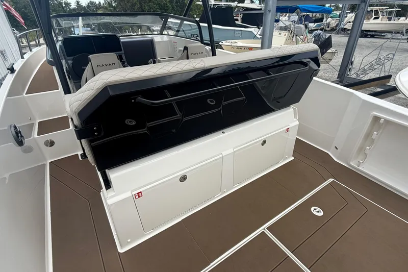 Slide: The Image of Navan S30 2026 boat interior with seating and storage compartments, featuring a sleek design. - 9