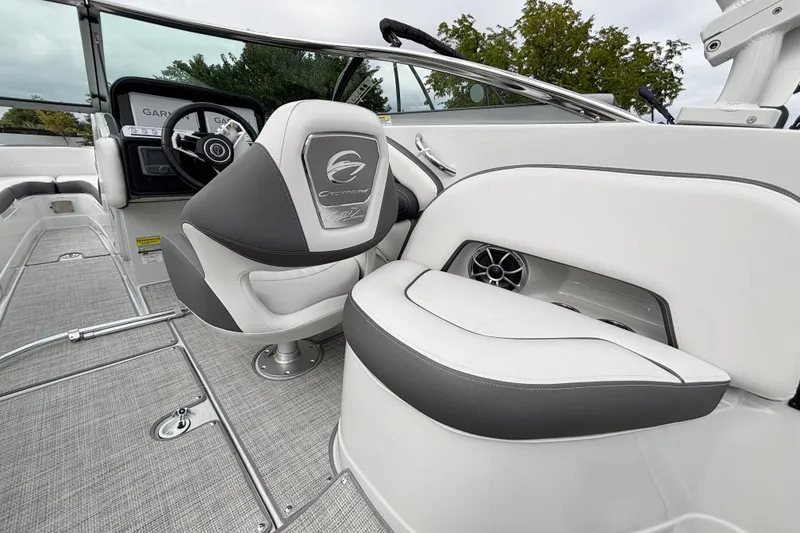 Slide: The Image of 2026 Crownline 260 XSS boat interior with sleek seating and modern dashboard. - 14
