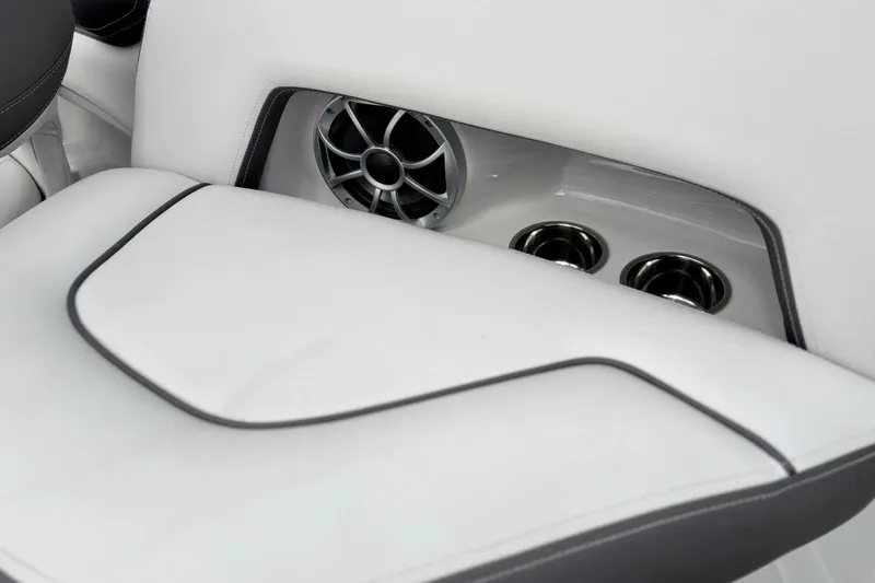 Slide: The Image of 2026 Crownline 260 XSS boat interior with speaker and cup holders. - 15