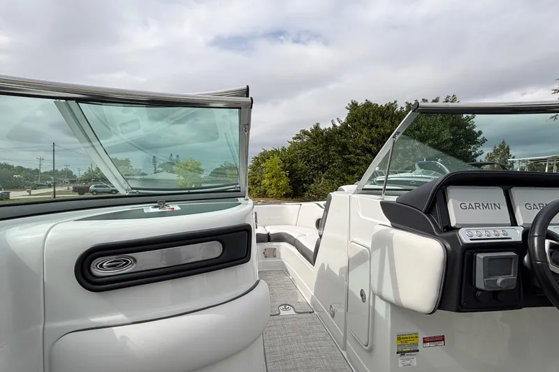 Slide: The Image of 2026 Crownline 260 XSS boat interior with Garmin navigation system and sleek design. - 18