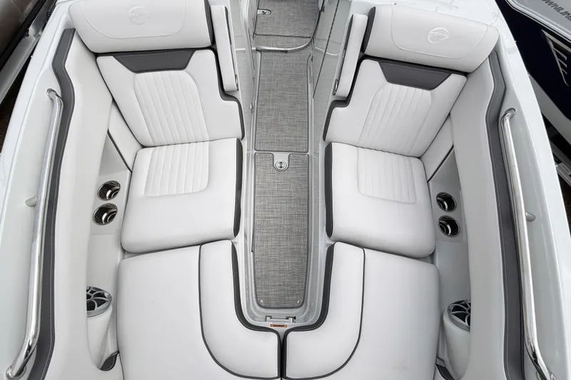 Slide: The Image of Luxurious interior of 2026 Crownline 260 XSS boat with white cushioned seating. - 26