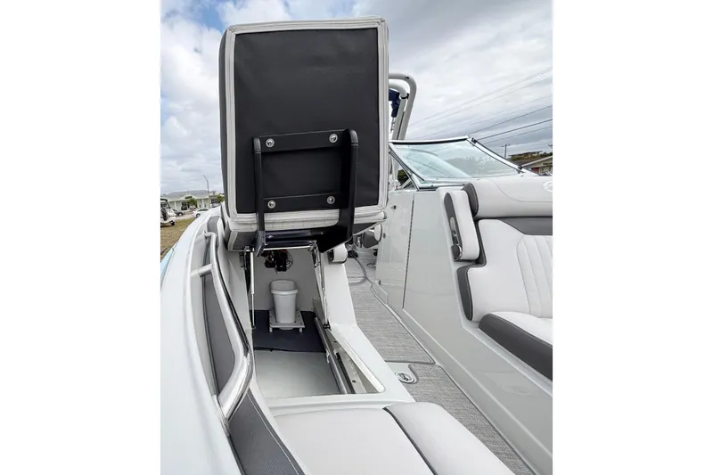 Slide: The Image of 2026 Crownline 260 XSS boat interior with open storage compartment and seating. - 27