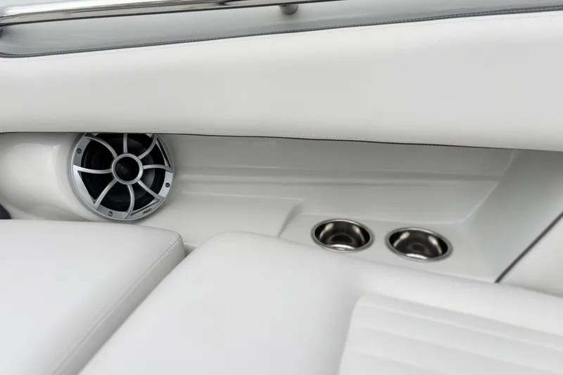 Slide: The Image of Interior of 2026 Crownline 260 XSS boat with speaker and cup holders. - 29