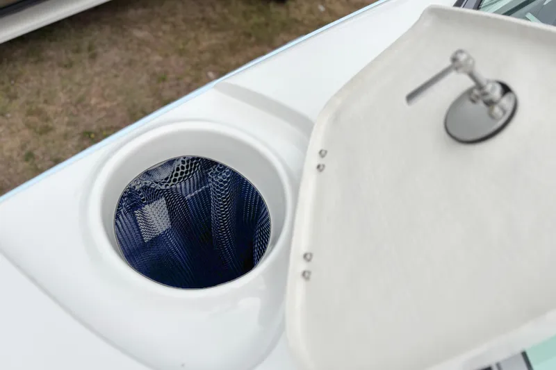 Slide: The Image of Open hatch on 2026 Crownline 260 XSS boat, revealing storage compartment. - 30