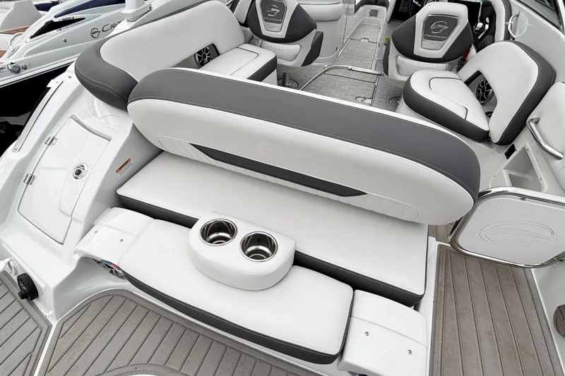 Slide: The Image of 2026 Crownline 260 XSS boat interior with luxurious seating and cup holders. - 32