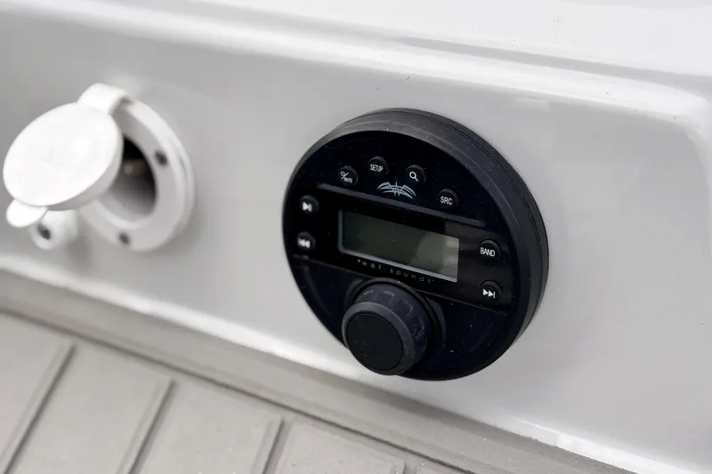 Slide: The Image of Control panel on 2026 Crownline 260 XSS boat, featuring a sleek black interface. - 33