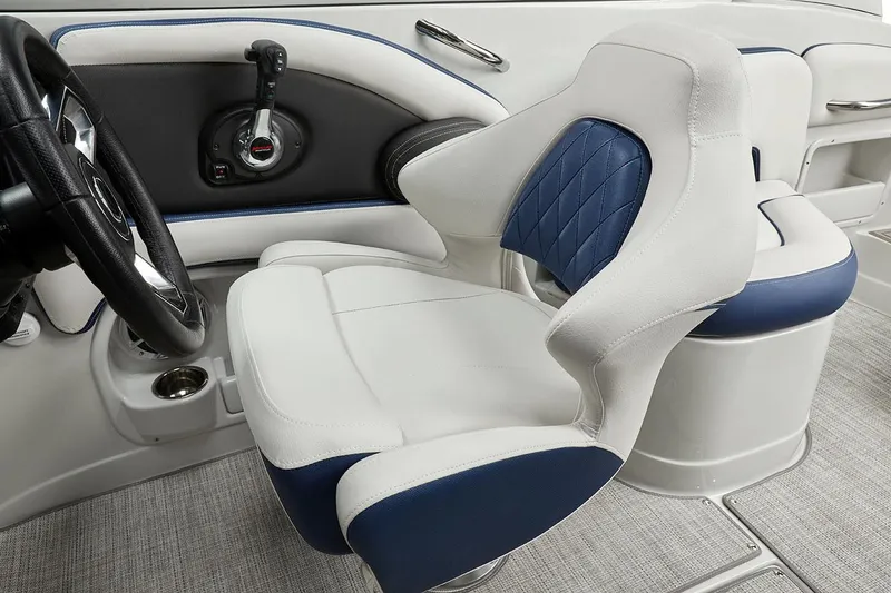 Slide: The Image of Steering wheel and dashboard of 2026 Crownline 260 XSS boat with modern controls. - 4