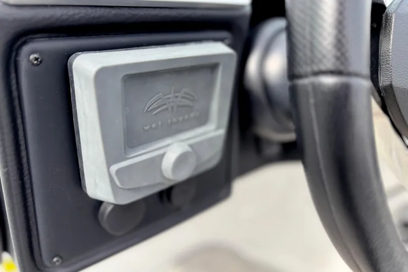 Slide: The Image of 2026 Crownline 260 XSS boat dashboard with Wet Sounds audio control. - 9