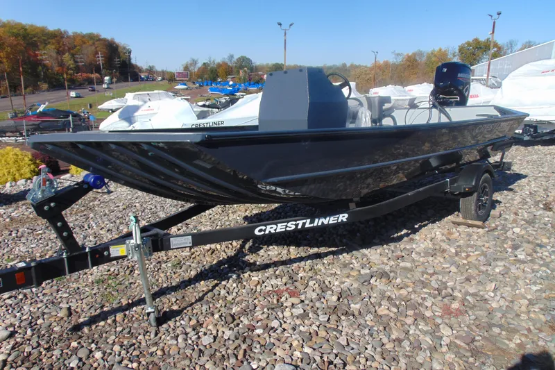 The Image of 2026 Crestliner 1870 Retriever FCC boat on trailer, displayed outdoors. - 1