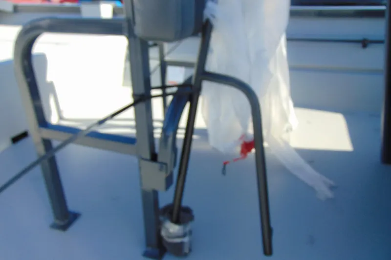 Slide: The Image of Blurry view of 2026 Crestliner 1870 Retriever FCC boat interior with metal frame and cables. - 10