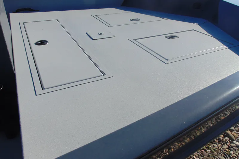 Slide: The Image of 2026 Crestliner 1870 Retriever FCC boat deck with storage compartments. - 11