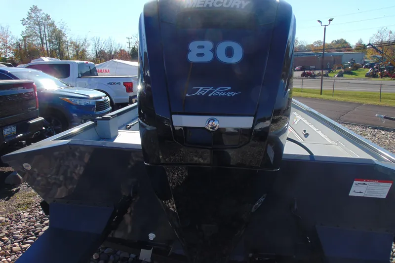 Slide: The Image of 2026 Crestliner 1870 Retriever FCC with Mercury 80 Jet Power engine, parked outdoors. - 3