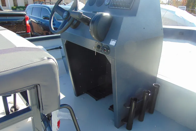 Slide: The Image of 2026 Crestliner 1870 Retriever FCC boat console with steering wheel and seating. - 8