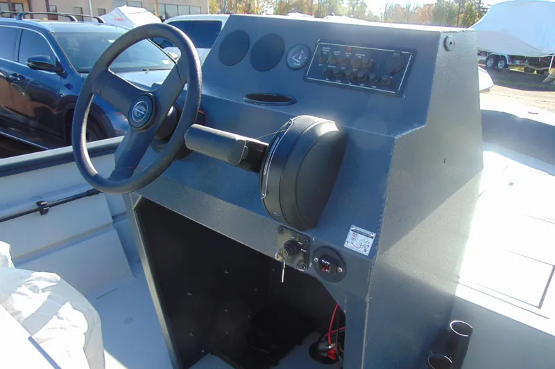 Slide: The Image of 2026 Crestliner 1870 Retriever FCC boat console with steering wheel and control panel. - 9
