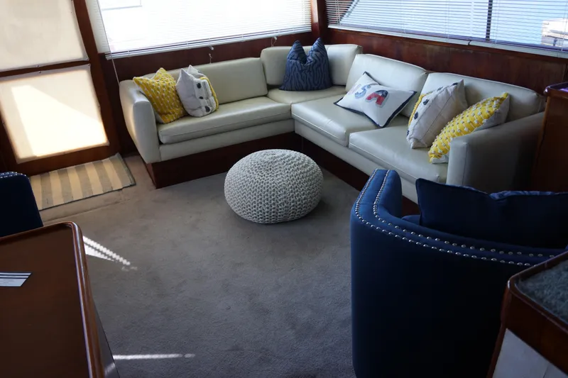 Slide: The Image of Luxurious 1988 Ocean Yachts Super Sport interior with cozy seating and decorative pillows. - 10
