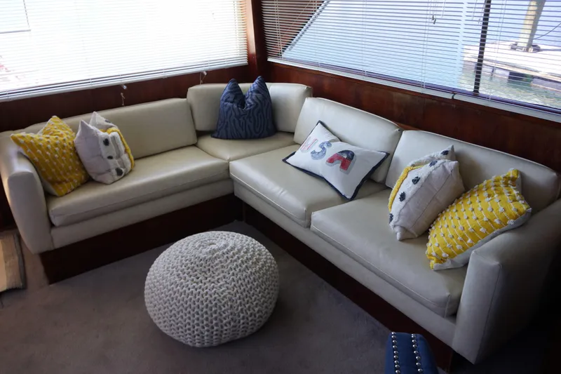Slide: The Image of Interior of 1988 Ocean Yachts Super Sport with cozy seating and decorative pillows. - 19