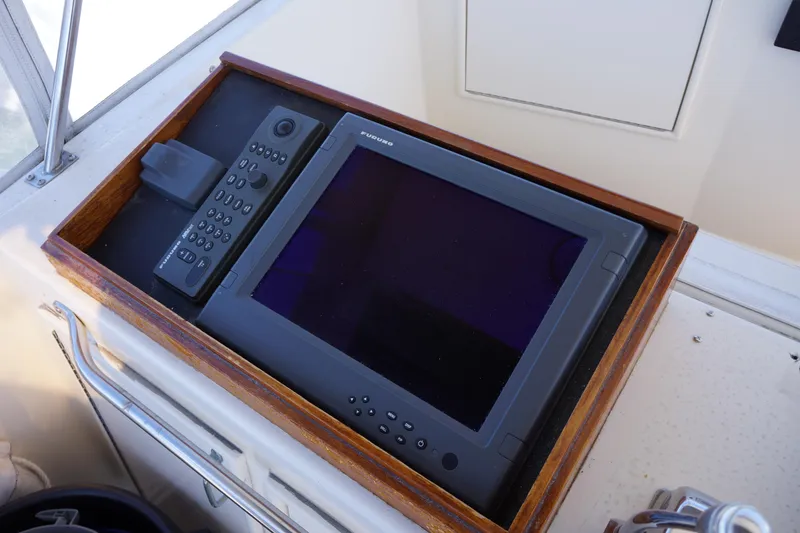 Slide: The Image of Control panel of 1988 Ocean Yachts Super Sport with navigation equipment. - 26