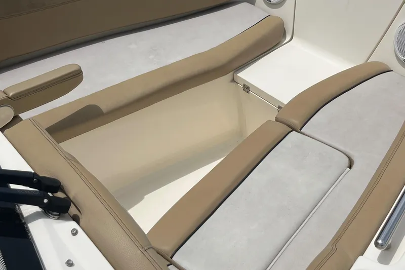 Slide: The Image of 2015 Scout 275 Dorado boat docked in a marina with surrounding vessels. - 12