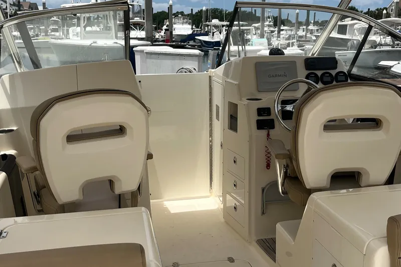 Slide: The Image of Dashboard of 2015 Scout 275 Dorado boat with Yamaha gauges and Fusion audio system. - 14