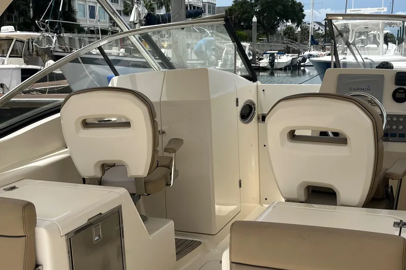 Slide: The Image of Yamaha tachometer and speed fuel gauges on 2015 Scout 275 Dorado boat dashboard. - 15