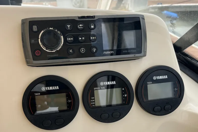 Slide: The Image of Open storage compartment on 2015 Scout 275 Dorado boat. - 19