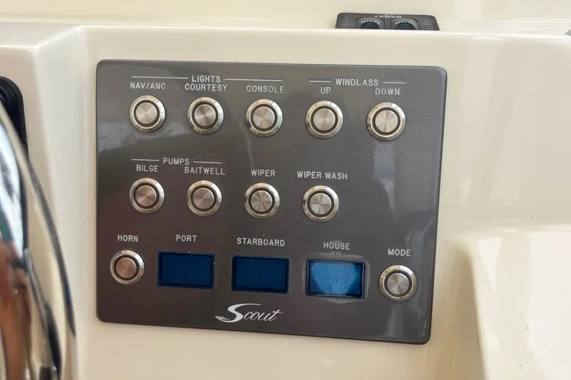 Slide: The Image of Open hatch revealing battery compartment in 2015 Scout 275 Dorado boat. - 20