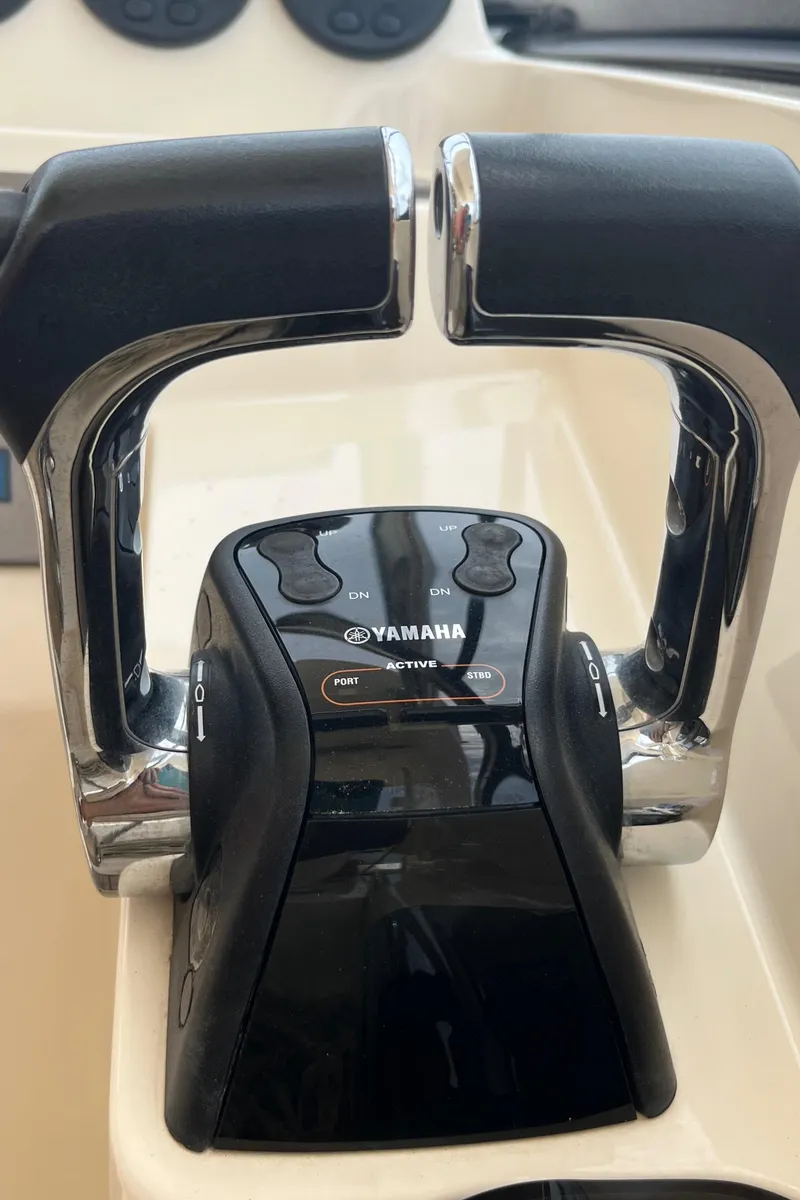 Slide: The Image of 2015 Scout 275 Dorado boat sink with open lid and faucet. - 21