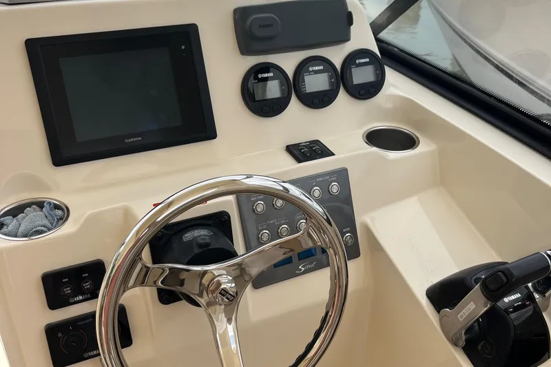 Slide: The Image of 2015 Scout 275 Dorado boat interior with seating and storage area. - 22