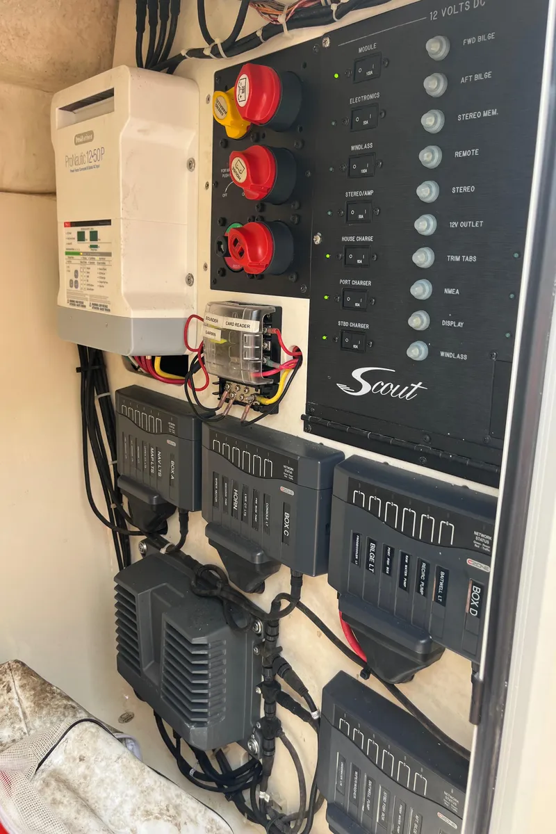 Slide: The Image of 2015 Scout 275 Dorado boat interior with beige seating and speaker. - 26