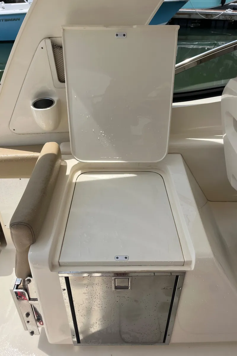 Slide: The Image of 2015 Scout 275 Dorado boat bathroom with sink, toilet, and wooden flooring. - 32