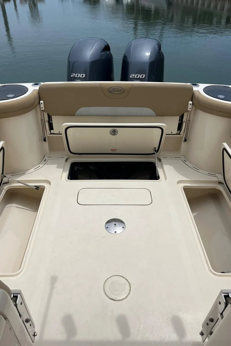Slide: The Image of 2015 Scout 275 Dorado boat helm with Garmin navigation system and steering wheel. - 36