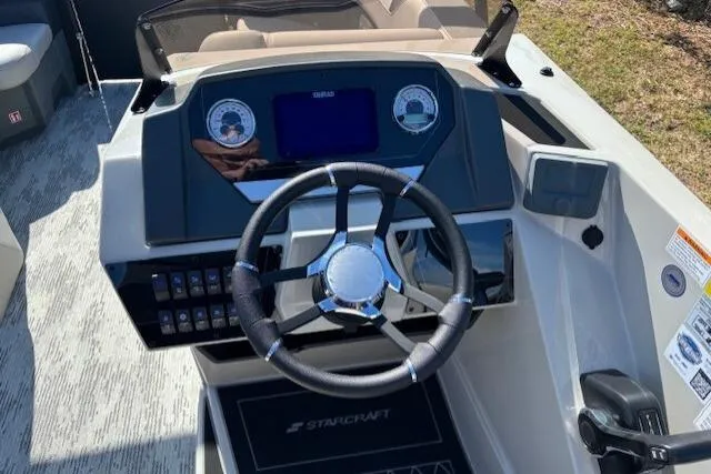 Slide: The Image of Steering console of 2026 Starcraft SLS 3 R boat with modern controls and dashboard. - 7