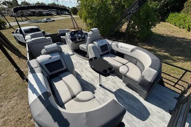 Slide: The Image of Luxurious 2026 Starcraft SLS 3 R pontoon boat with spacious seating and modern design. - 9