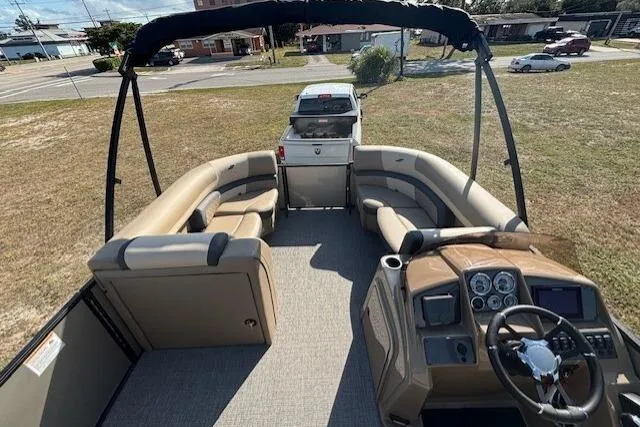 Slide: The Image of 2026 Starcraft EXS 3 DL pontoon boat with spacious seating and modern dashboard. - 11